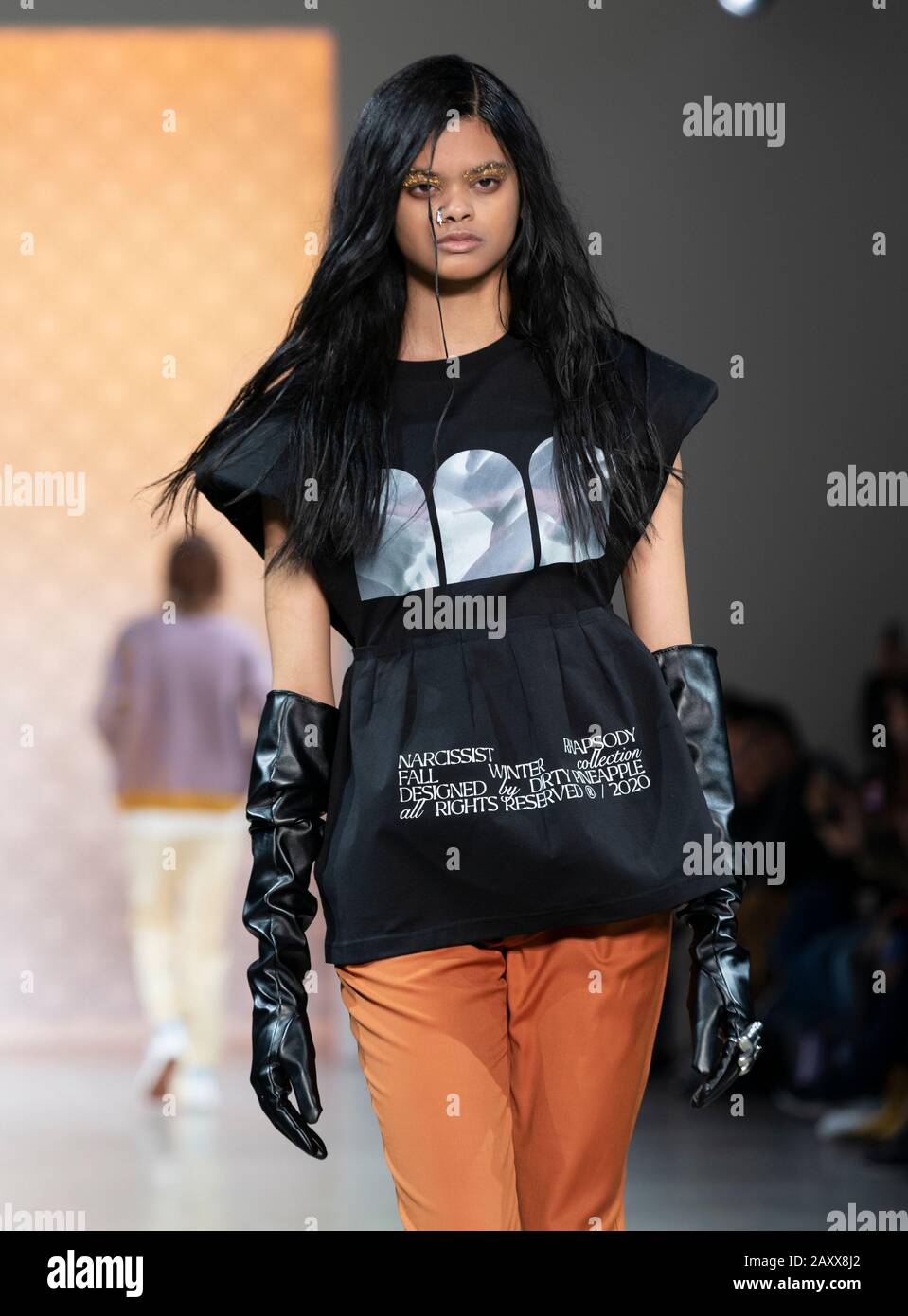 New York, NY - February 12, 2020: Model walks runway for Dirty Pineapple by Elsa Zai and Nellie Wang collection during Fashion Week at Spring Studios Stock Photo