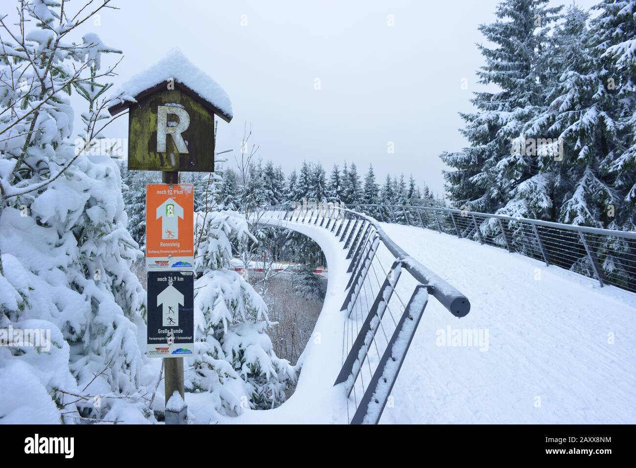 Oberhof, Germany 12-14-2019 Rennsteig hike path with signs bridge for skiing and wintersport Stock Photo