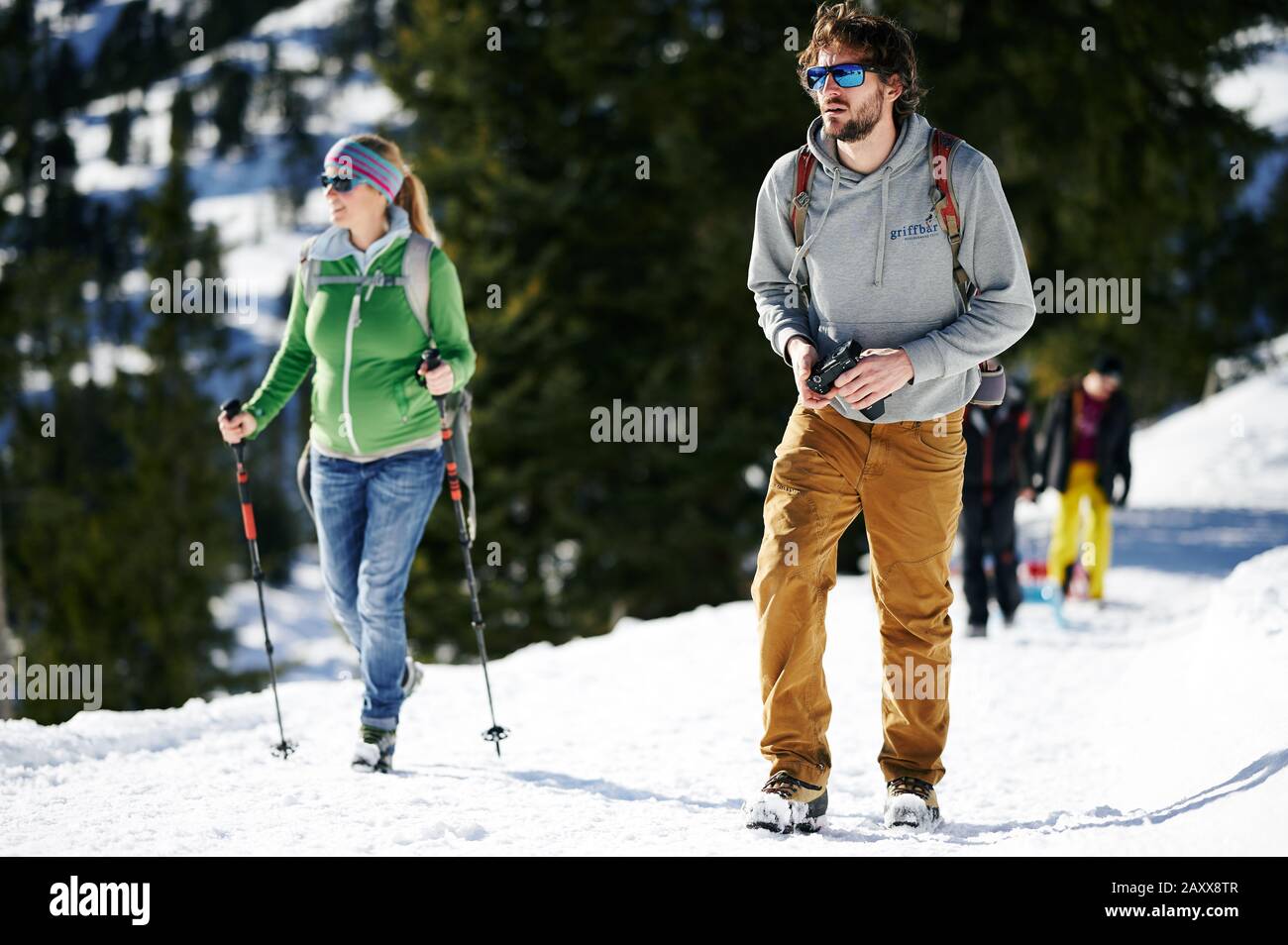 A couple walking outside on snow. Stock Photo