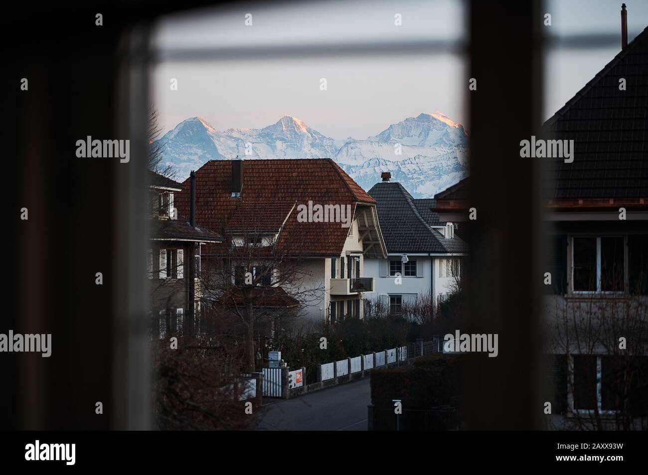 View from a window towards Eiger, Monch and Jungfrau. Thun, Switzerland Stock Photo
