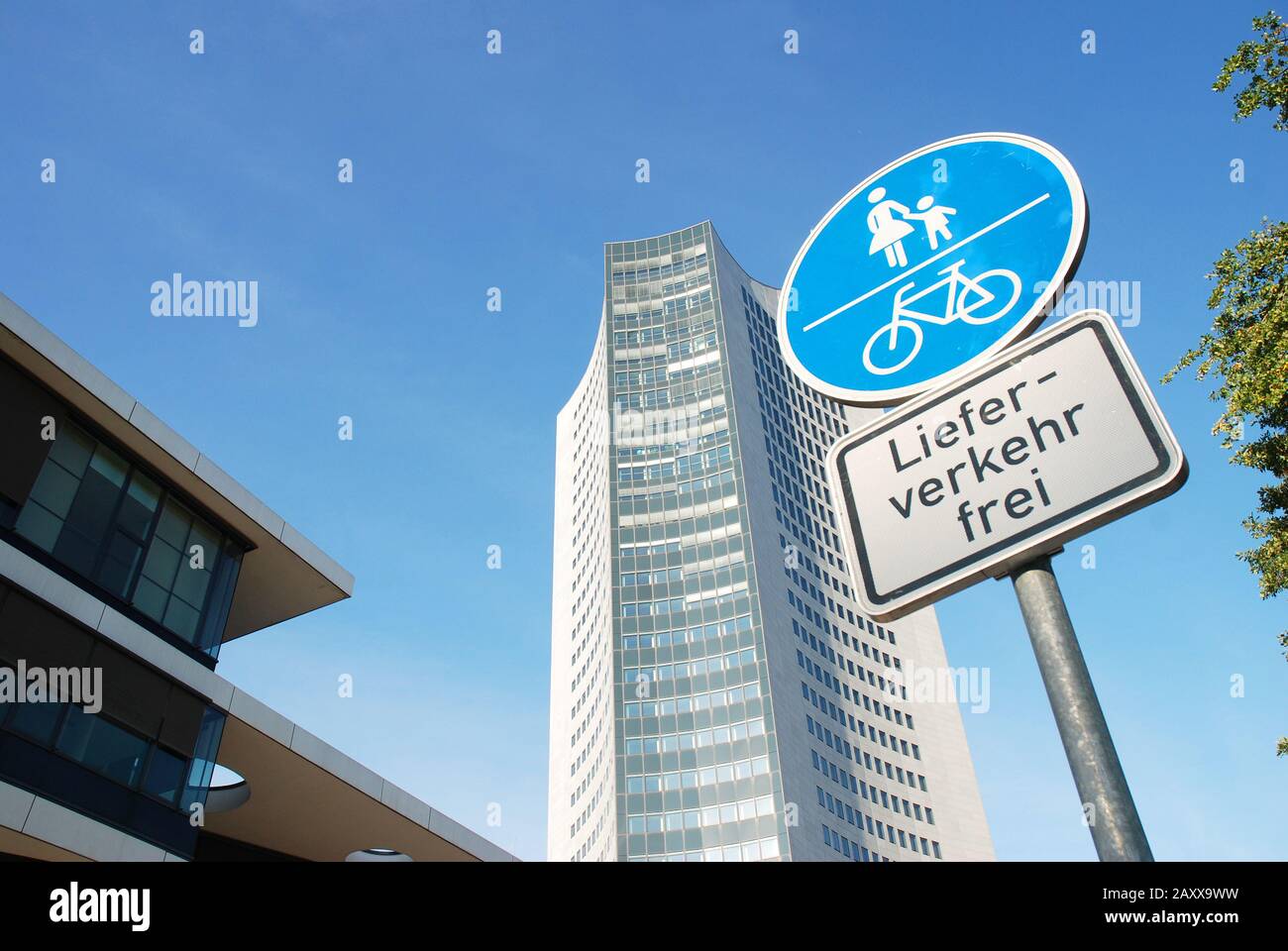 Traffic concept in the town innercity buidlings and road sign only for pedestrian, bicycle and-delivery traffic in german Stock Photo
