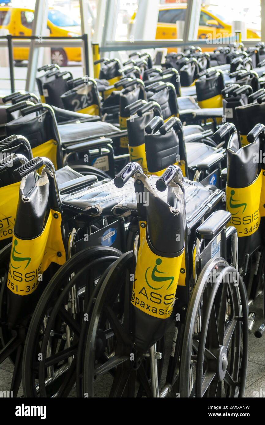 Wheelchairs available at JFK International Airport, NYC, USA Stock