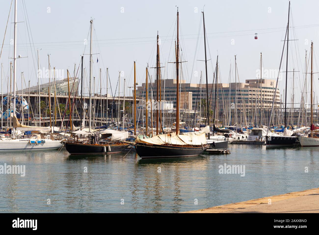 BARSELONA, SPAIN - AUGUST 6, 2019: Yachts parked in the port of Barcelona at summer noon. Stock Photo