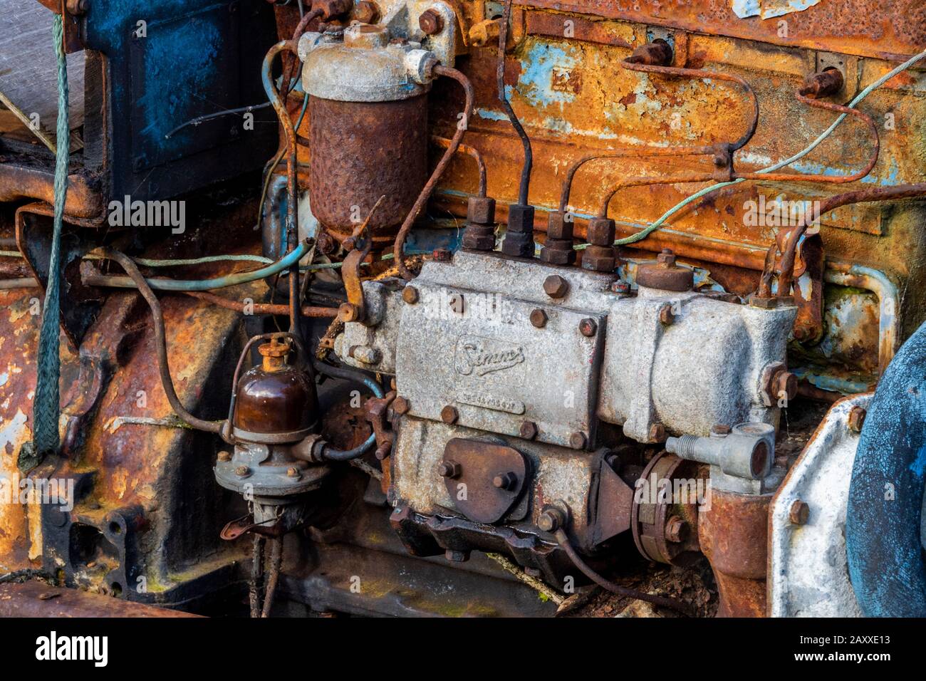 an old car petrol or diesel engine rusting and corroding away damaging
