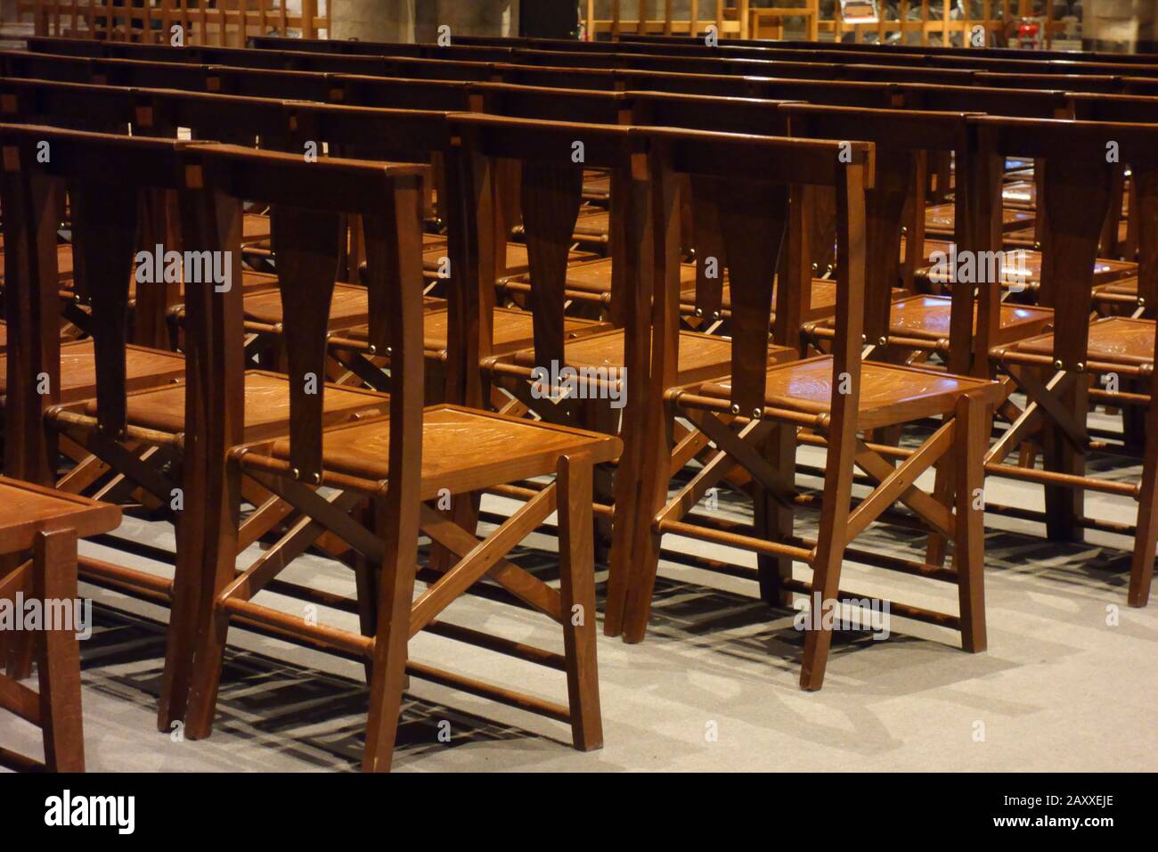 Inside the Cathedral of Siena. Side view of the nave with chairs for mass. Stock Photo