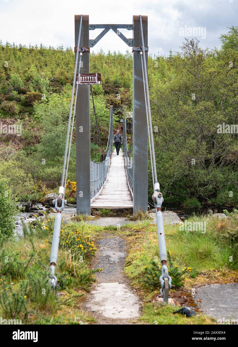 Gruids suspension bridge leading to Lairg Train station Stock Photo