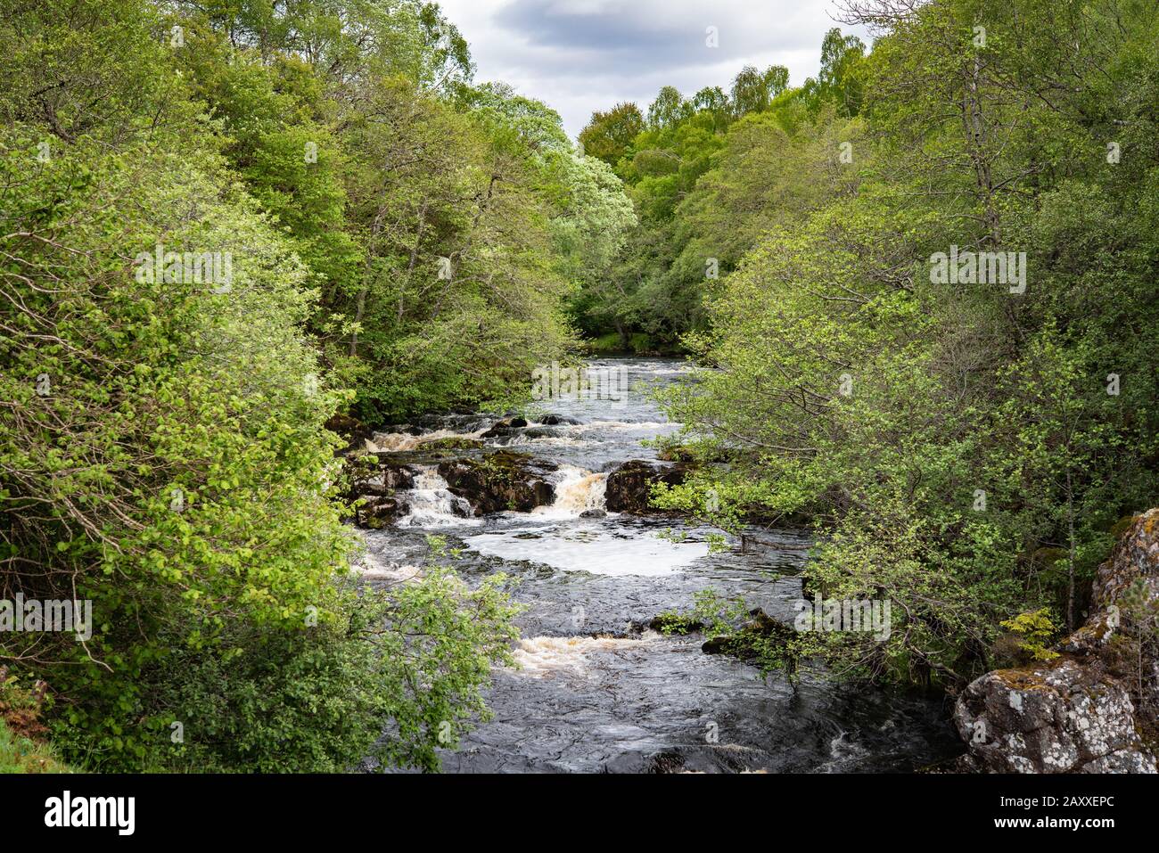 Flowing river at Shin Glen in Lairg, just before the Shin falls Stock Photo