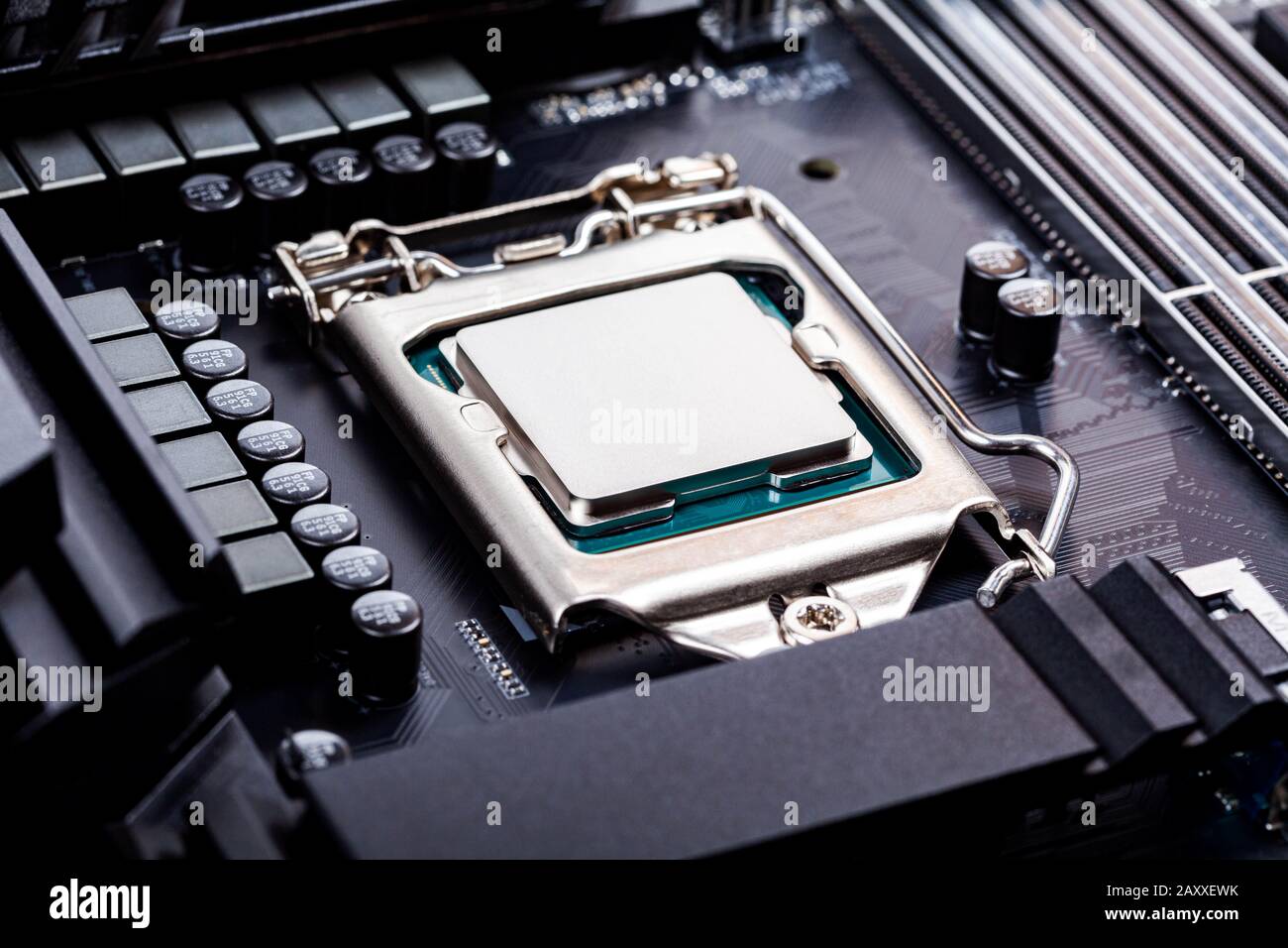 Blank CPU lid top, socket cover view angle processor placed and locked in the socket on a brand new modern high end gaming productivity motherboard Stock Photo