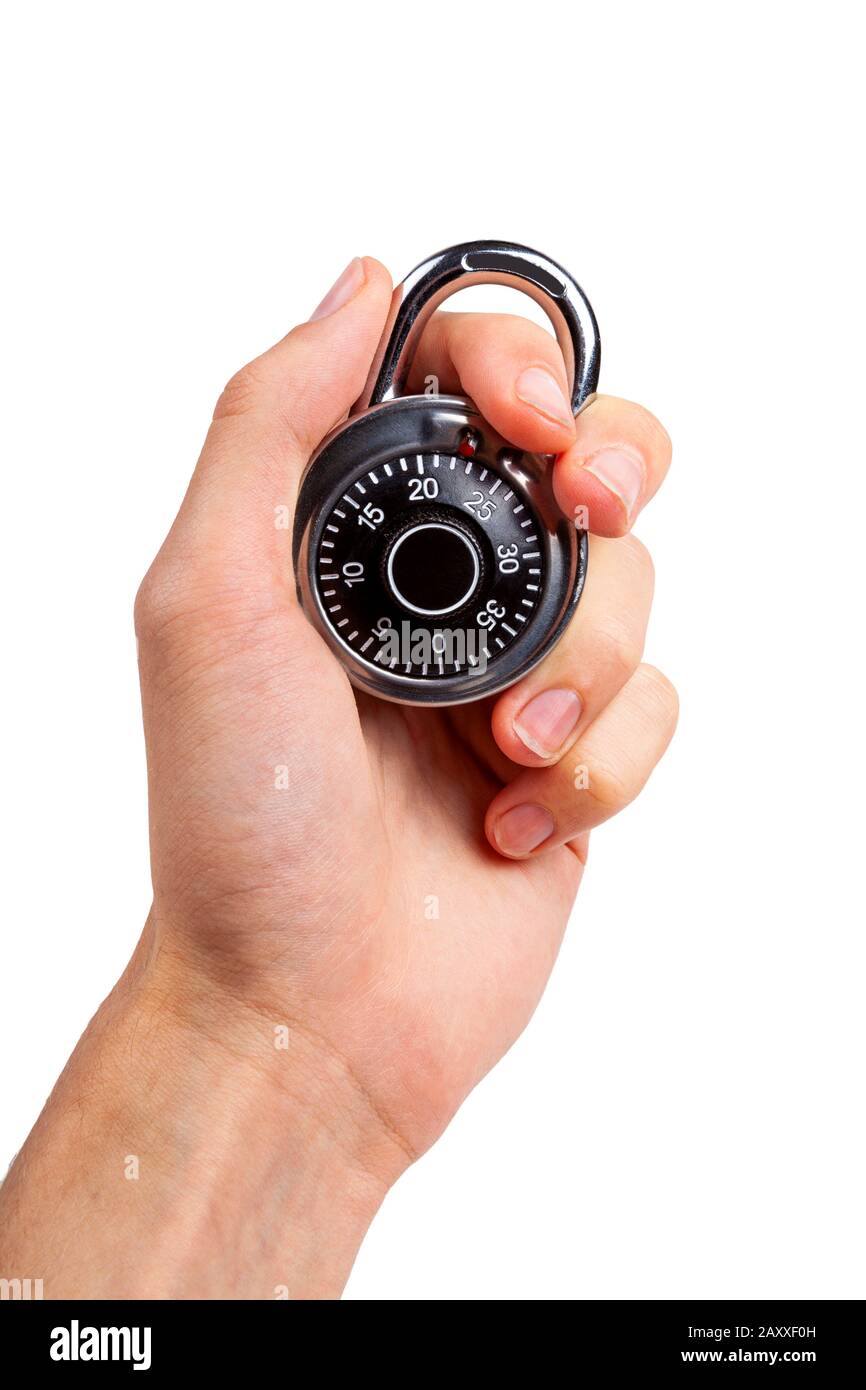 Human hand holding up a round closed locked coded padlock, closeup