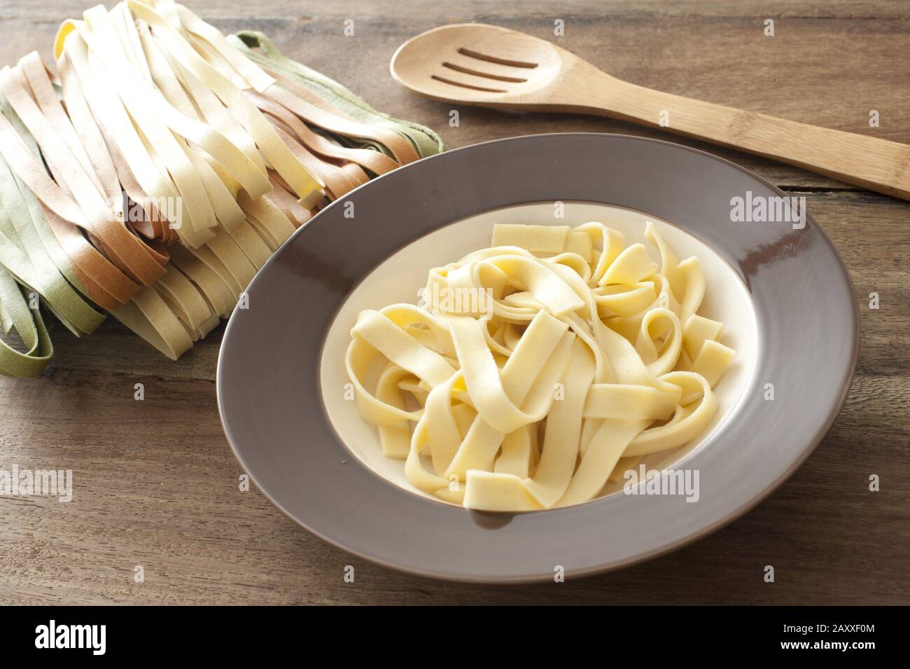 A bowl of cooked plain tagliatelli waiting for some sauce Stock Photo