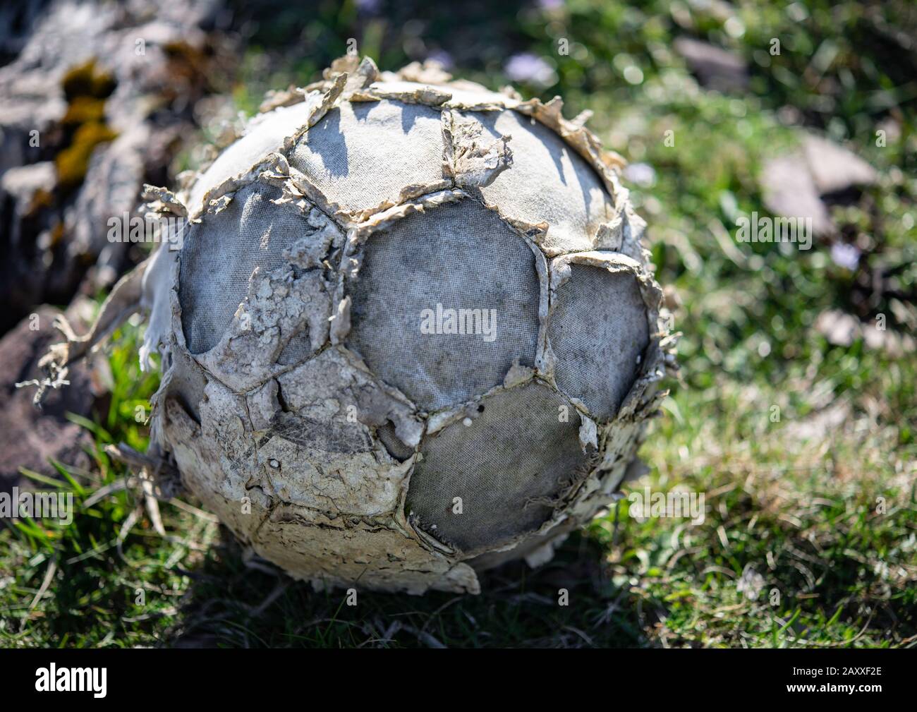 Old fallen apart abandoned football Stock Photo
