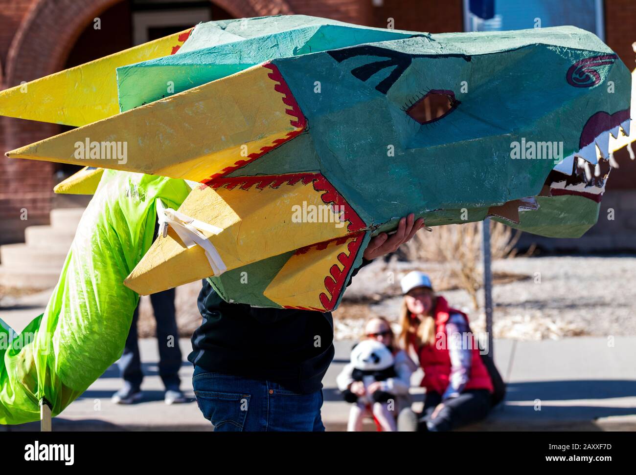 Children & adults dance in fancy costumes at Salida, Colorado's, 3rd annual Lunar New Year Parade. Stock Photo