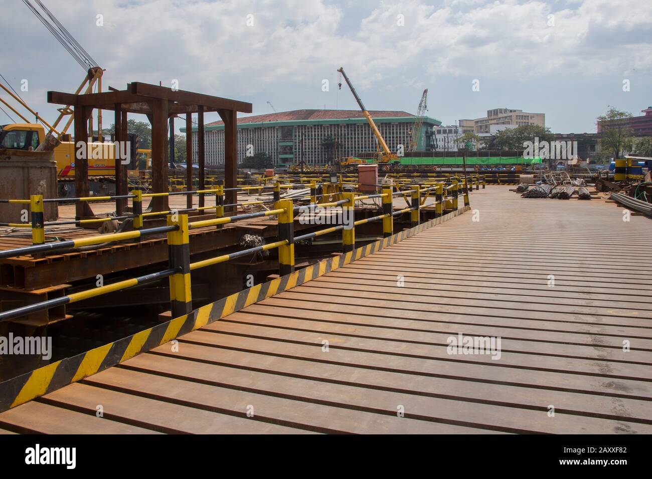 A bridge that  cuts through the Pasig River is currently under construction to alleviate the traffic conditions in the city. Stock Photo