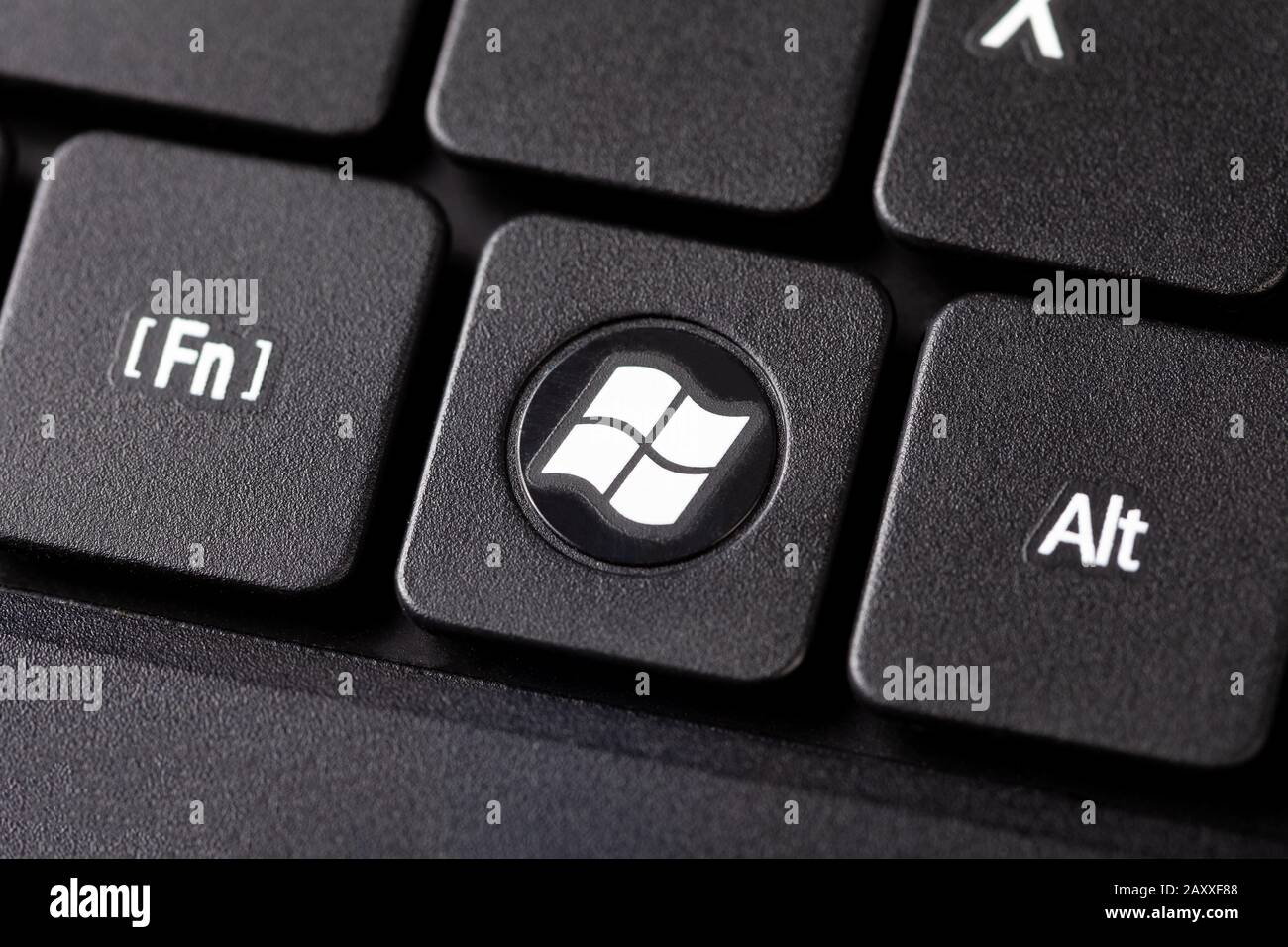 The Windows Button On A Black Laptop Notebook Keyboard Macro Extreme Closeup Top View Round Dedicated Operating System Key With White Windows Logo Stock Photo Alamy