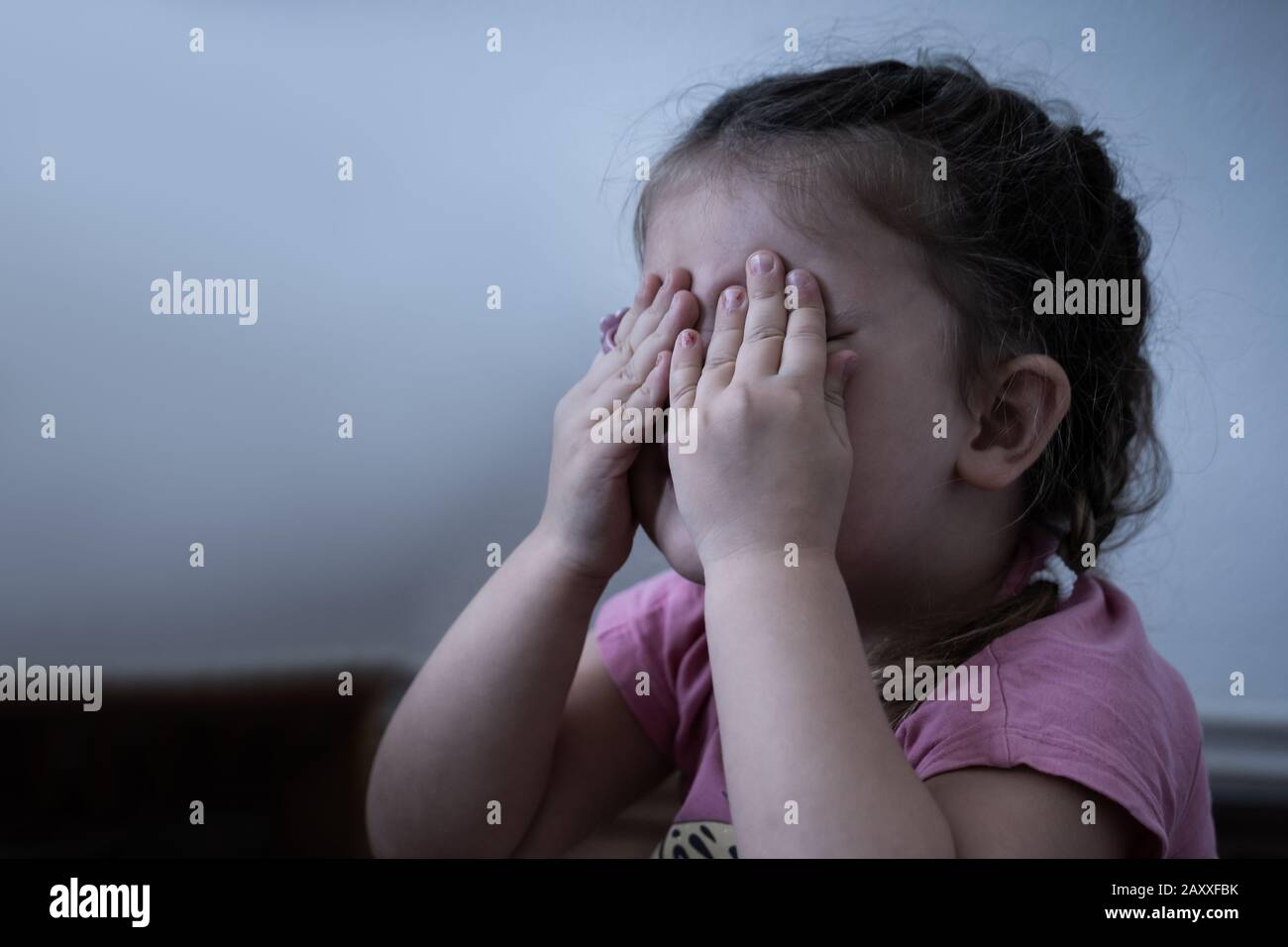 Little Girl Crying. Very Sad Girl Covering Her Eyes Stock Photo ...