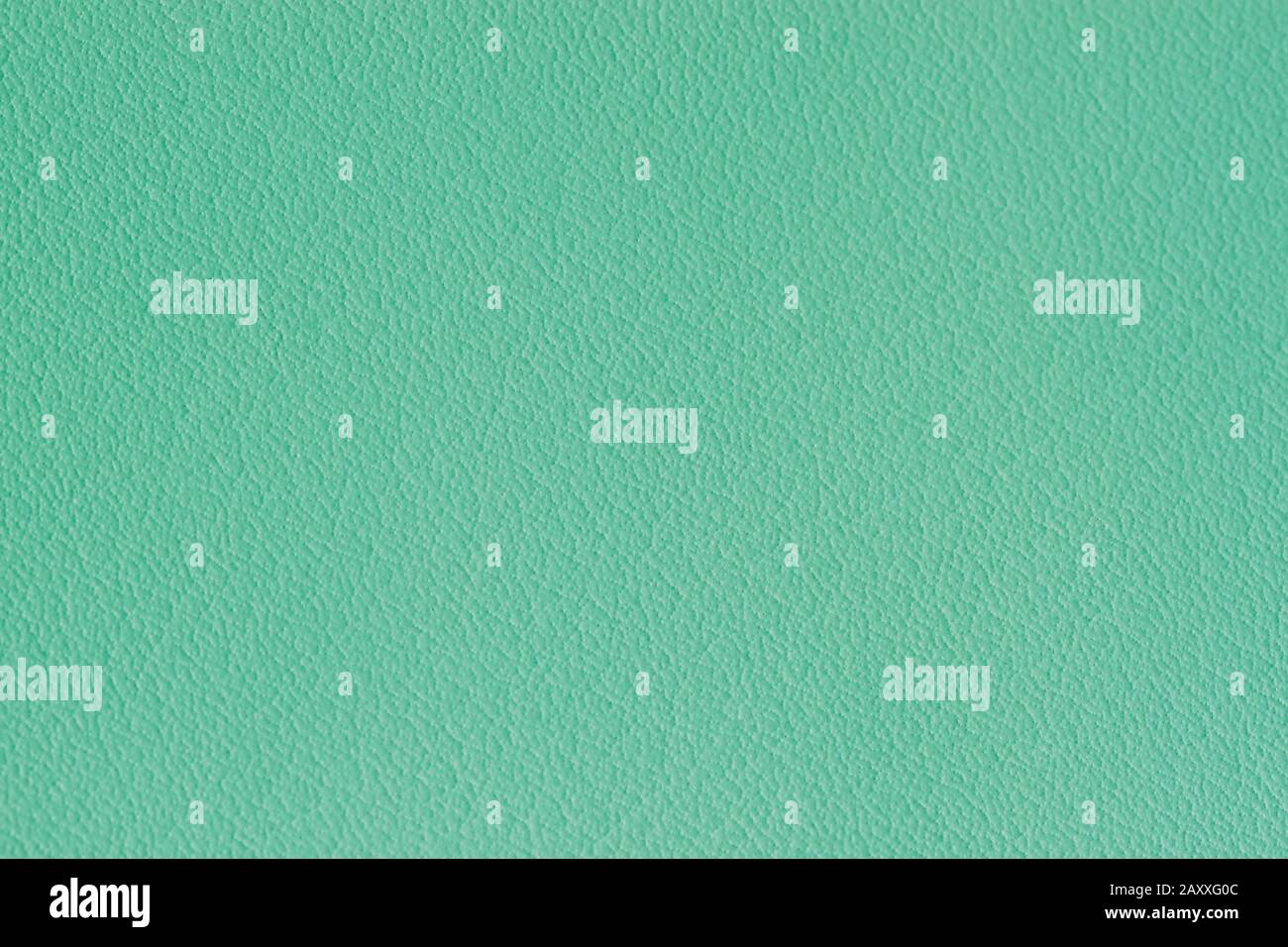 Texture of genuine grainy leather of light mint green color for modern background, copy space Stock Photo