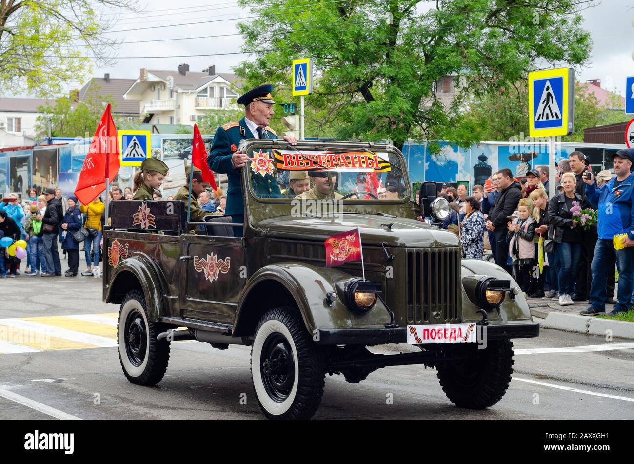 Anapa, Russia - May 9, 2019: Veterans ride the streets of the city of Anapa in an old restored military vehicle Stock Photo