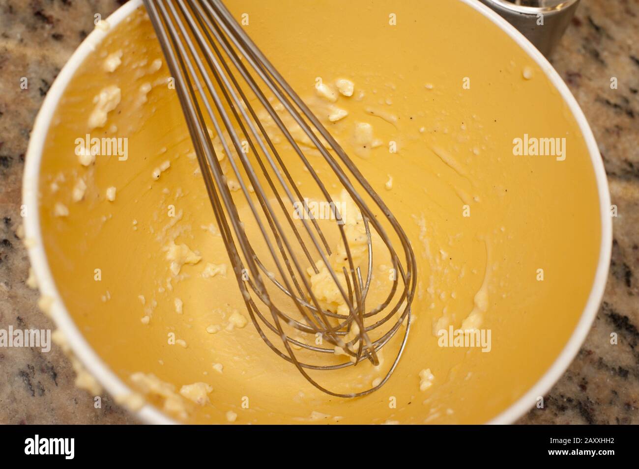 Bowl of mixing dough in messy kitchen - Stock Image - F005/2392