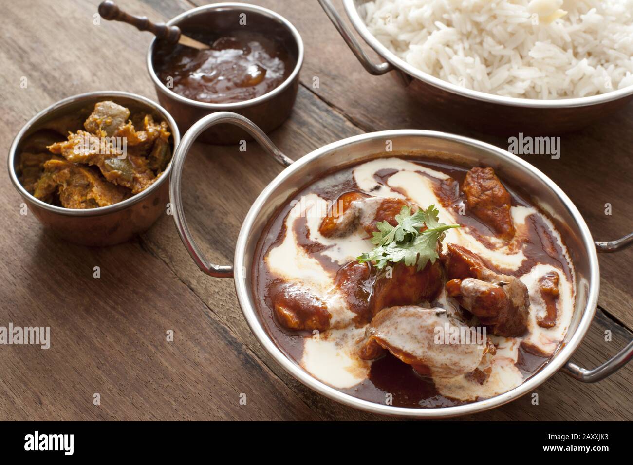 Delicious display of asian cuisine in pots filled with white rice