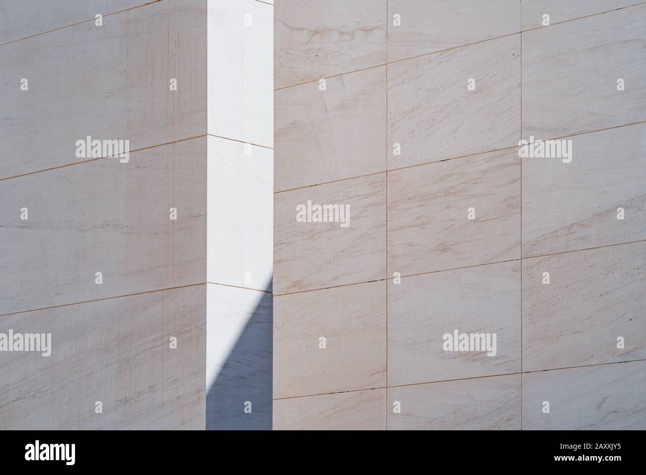 Light and shadow between white limestone walls Stock Photo
