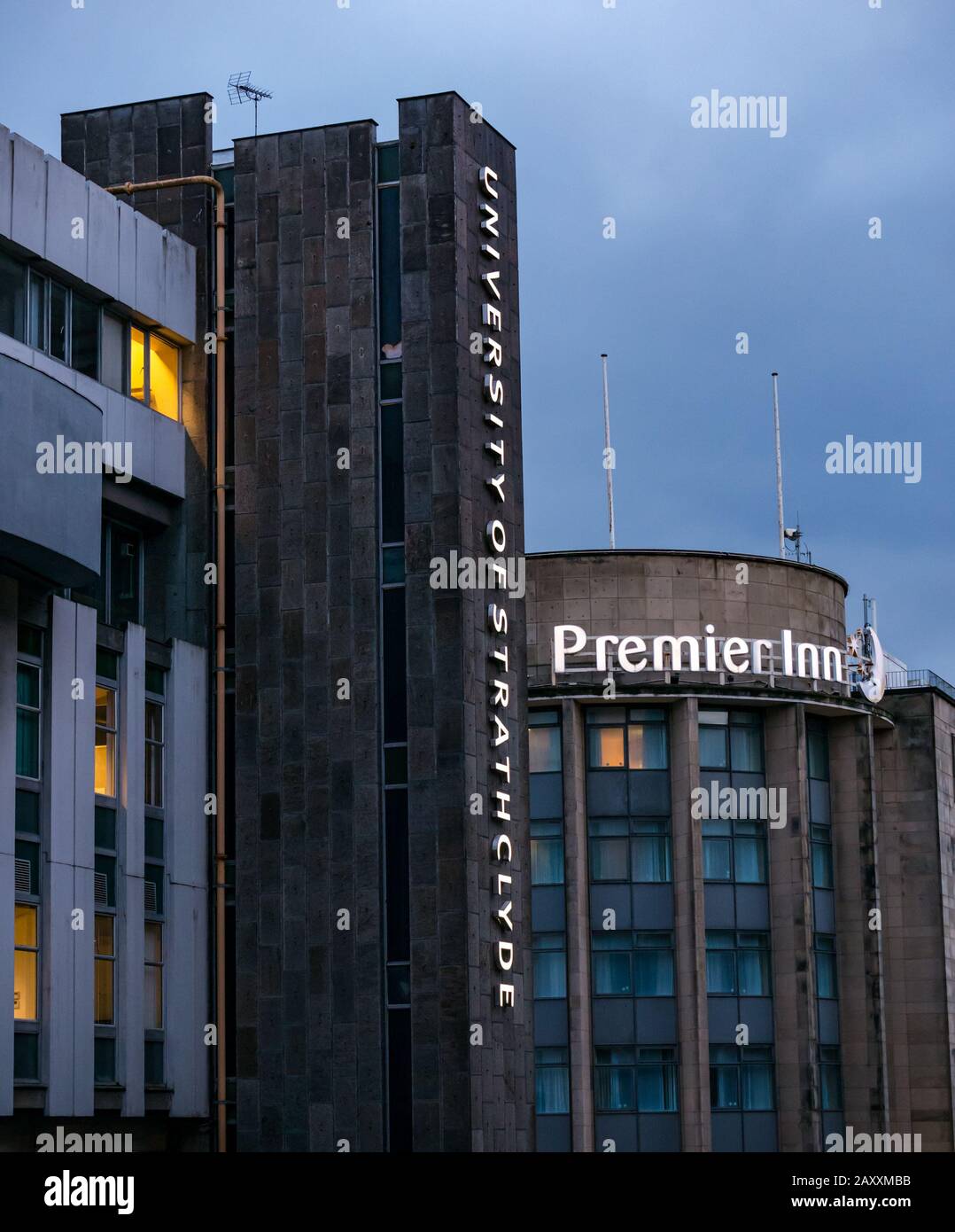 Premier Inn & Strathclyde University lit neon name sign at dusk, George Street, Glasgow, Scotland, UK Stock Photo