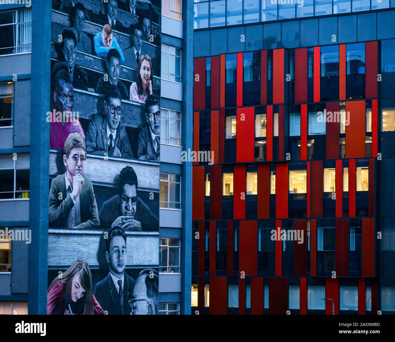 Student lecture mural by Art Pistol, Rogue One & Ejek, Gfraham Hills building at dusk & lit office windows, George Street, Glasgow, Scotland, UK Stock Photo