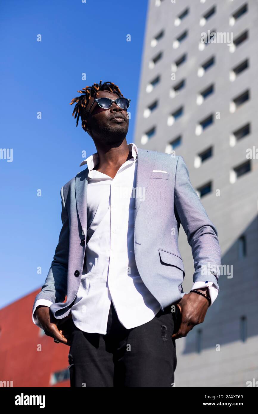 Front view of black african man wearing elegant clothes standing in the ...