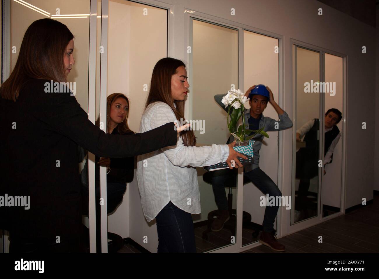Female businesswoman dismisses her employee in office in Mexico City Stock Photo