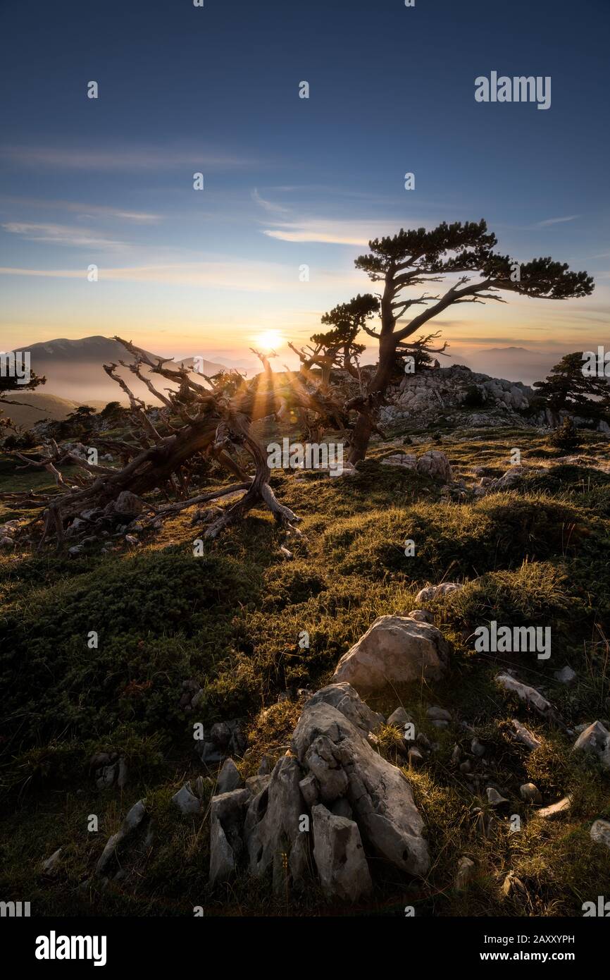 Sunset trough the mountains in Pollino National Park Stock Photo