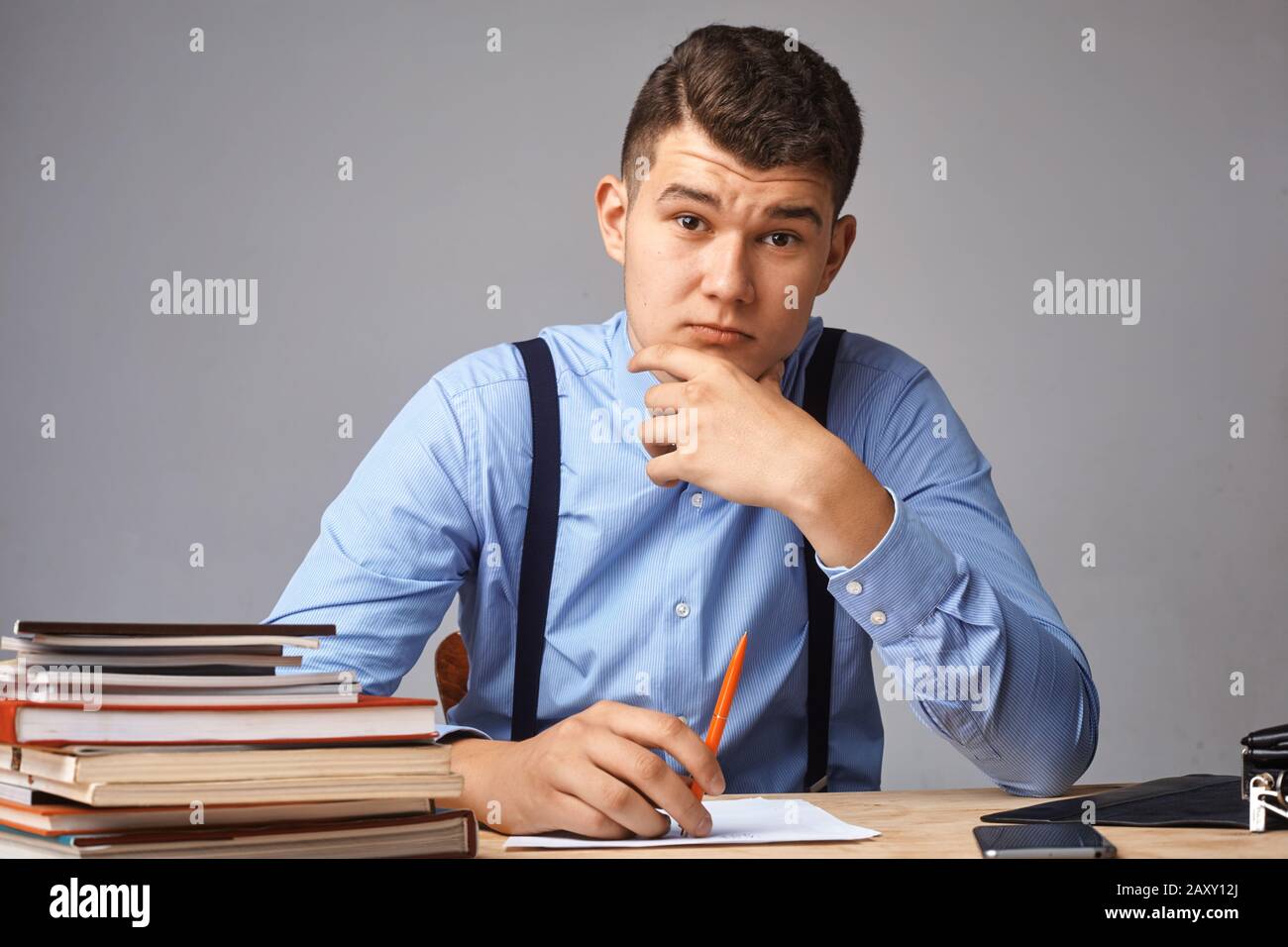 young man in the workplace thinking about something Stock Photo