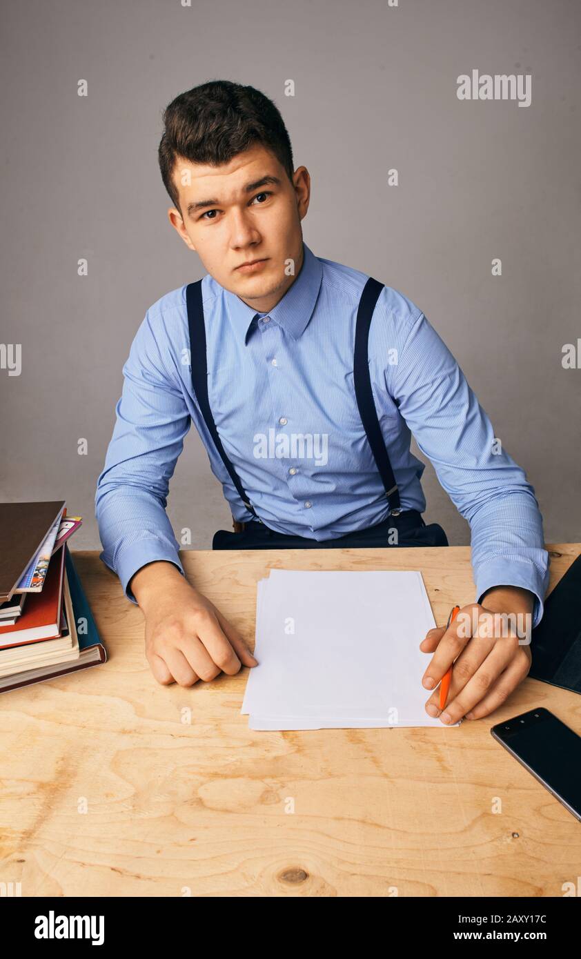 young man in the workplace thinking about something Stock Photo