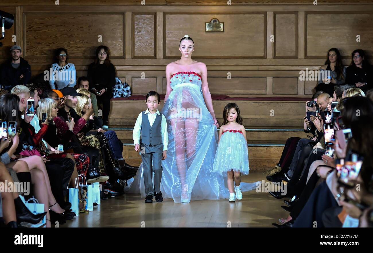 London, UK. 13th February, 2020. Paris Summer Allen is a catwalk model and  heavy pregnant modelling at The British luxury Womenswear designer, Chanel  Joan Elkayam, showcases her Autumn - Winter 2020 show