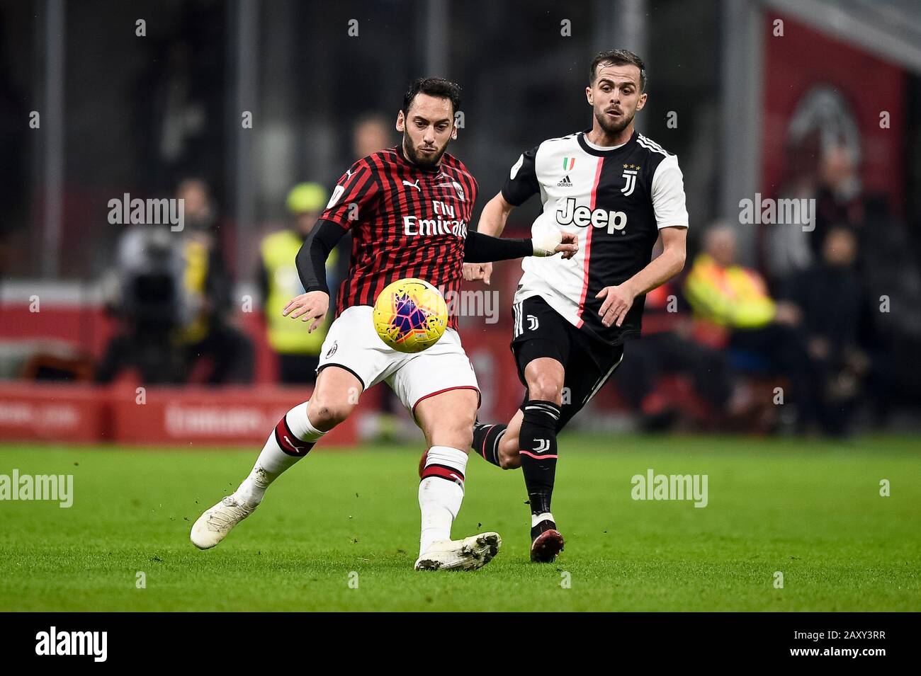 Milan, Italy - 13 February, 2020: Hakan Calhanoglu (L) of AC Milan is challenged by Miralem Pjanic of Juventus FC during the Coppa Italia semi final football match between AC Milan and Juventus FC. Credit: Nicolò Campo/Alamy Live News Stock Photo