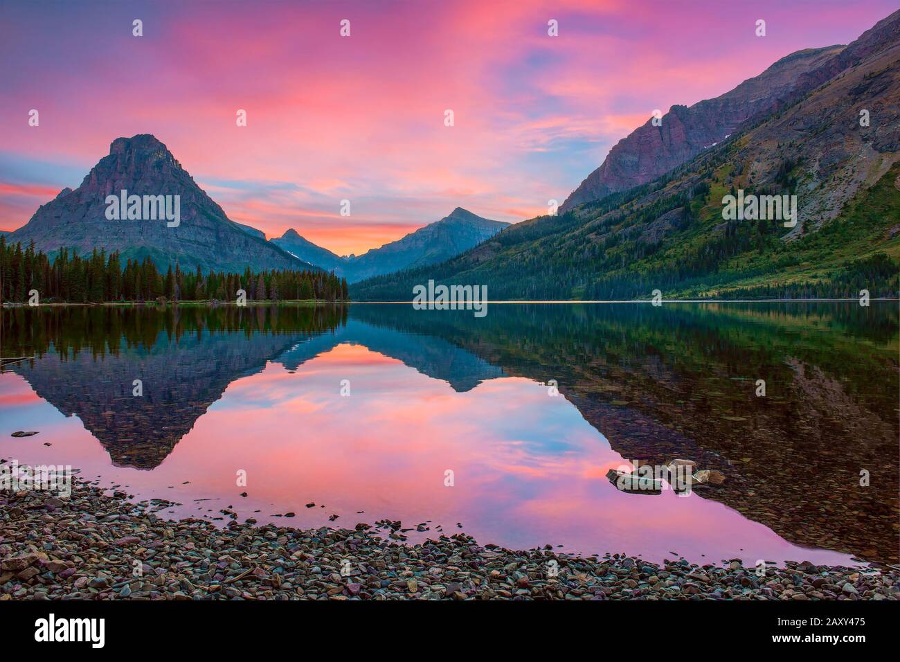 Sinopah Mountain and its reflection in Two Medicine Lake at sunset