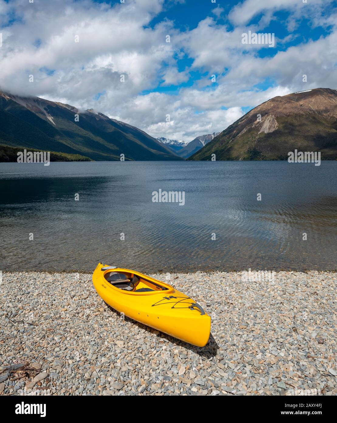Yellow kayak on pebble beach, Lake Lake Rotoiti, Nelson Lakes National Park, Tasman District, South Island, New Zealand Stock Photo