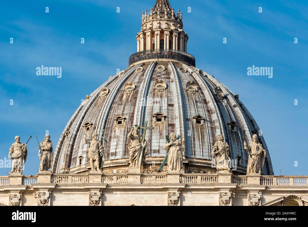 Cupola of St. Peter's Basilica with statues of Saints Thomas, James, John the Baptist, Jesus Christ, Andrew, John the Evangelist and James the Less Stock Photo