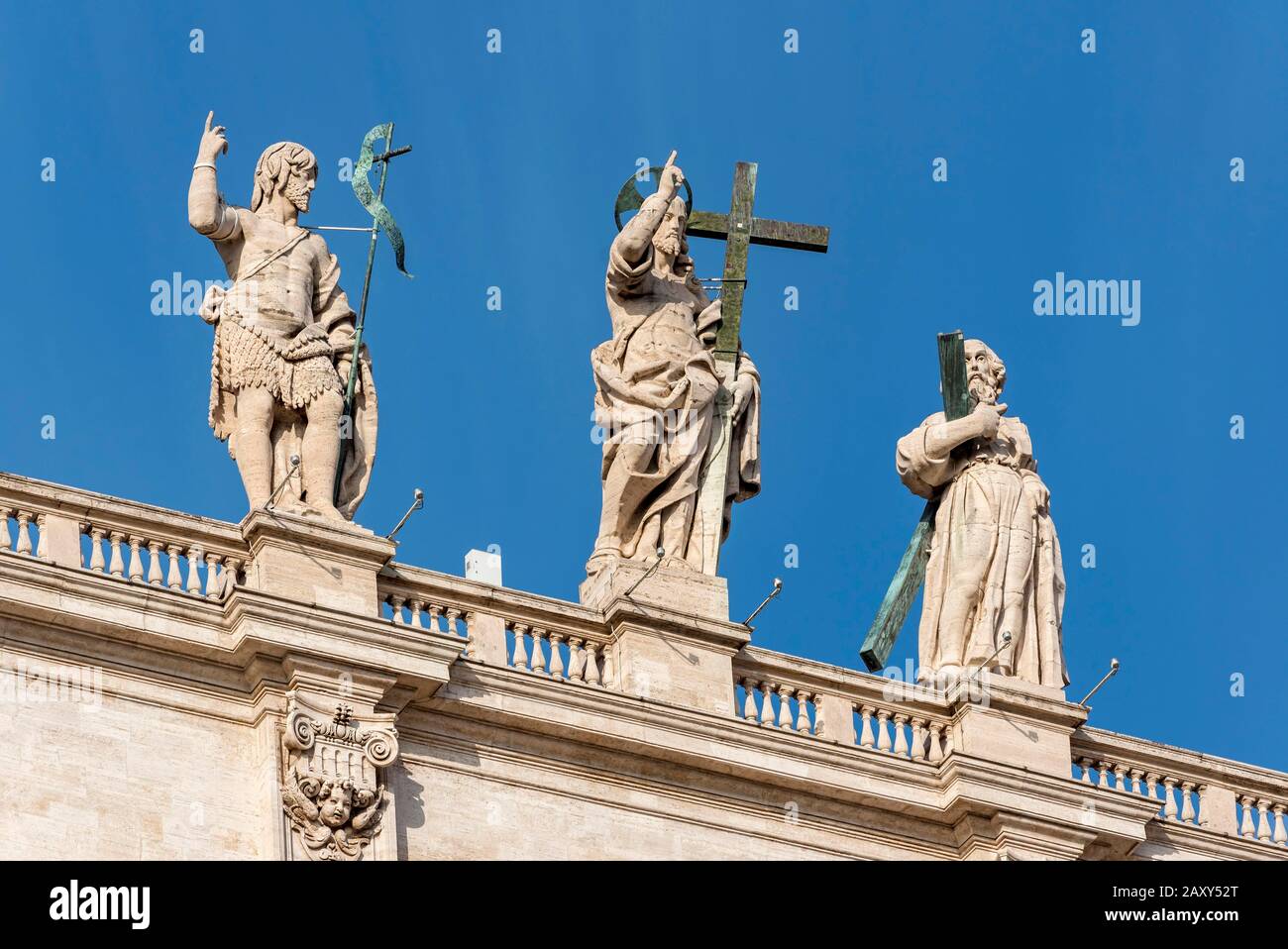 Statues of John the Baptist, Jesus Christ and St. Andrew on the facade of St Peter's Basilica, Piazza San Pietro, Vatican, Rome, Italy Stock Photo