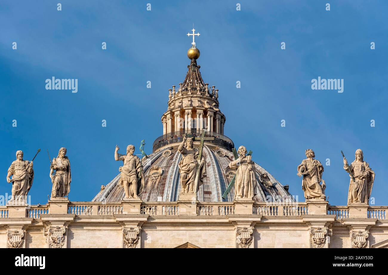Dome of St. Peter's Basilica with statues of Saints Thomas, James, John the Baptist, Jesus Christ, Andrew, John the Evangelist and James the Less Stock Photo