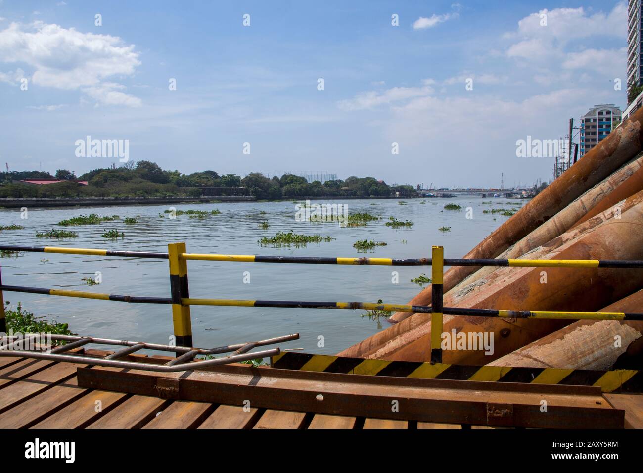 A bridge that  cuts through the Pasig River is currently under construction to alleviate the traffic conditions in the city. Stock Photo