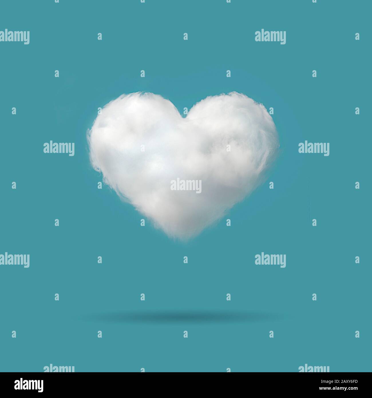 Heart shaped cloud in the blue backgroud with space for text, valentines day background. Stock Photo