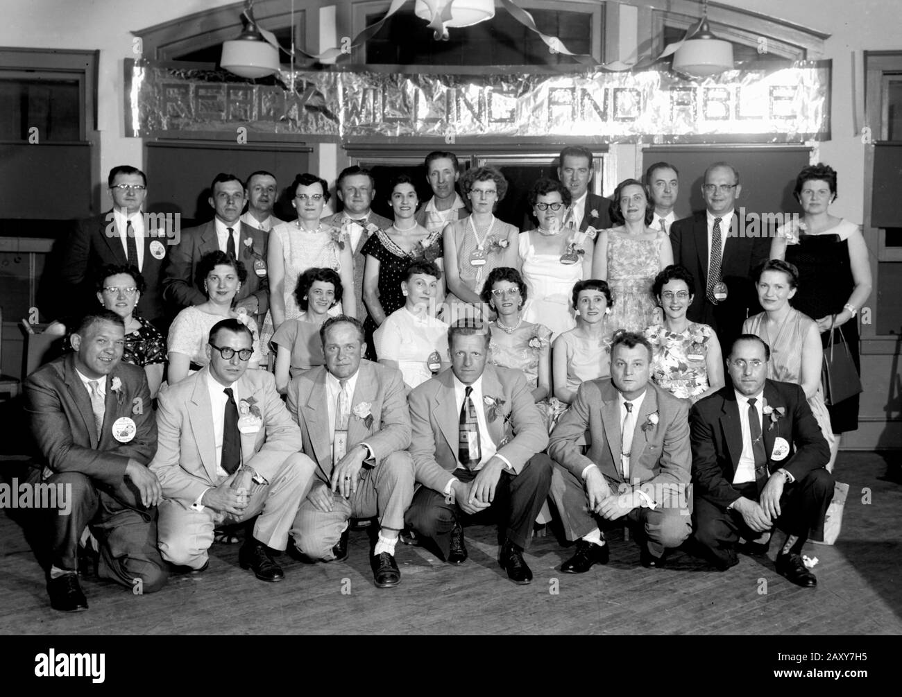 Class reunion photo. Ready, willing and able. ca. 1960. Stock Photo