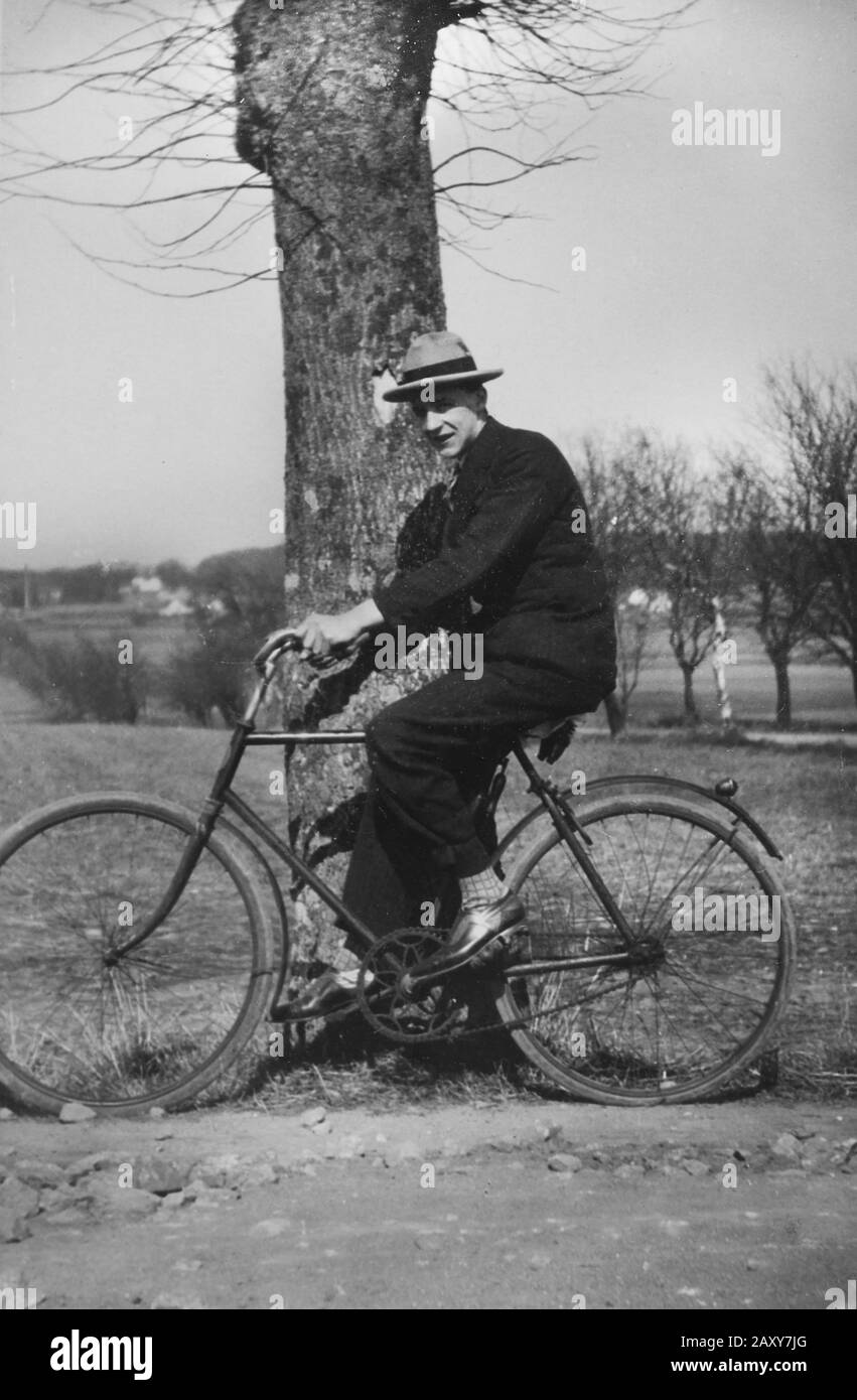 A man and his bike, ca. 1920. Stock Photo