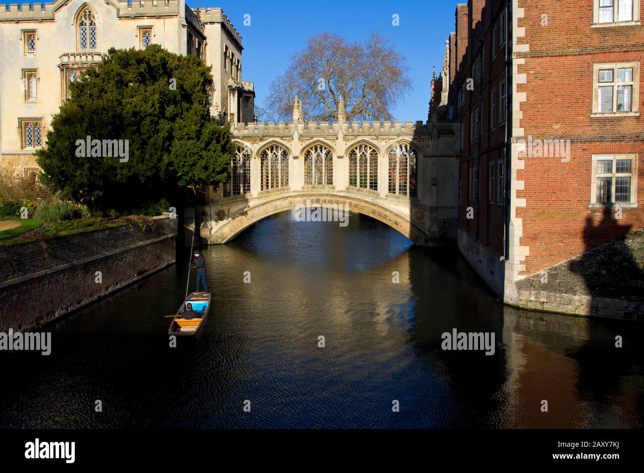 The Bridge of Sighs in Cambridge,England, a covered bridge at St John's College, with people punting along the River Cam towards the bridge Stock Photo