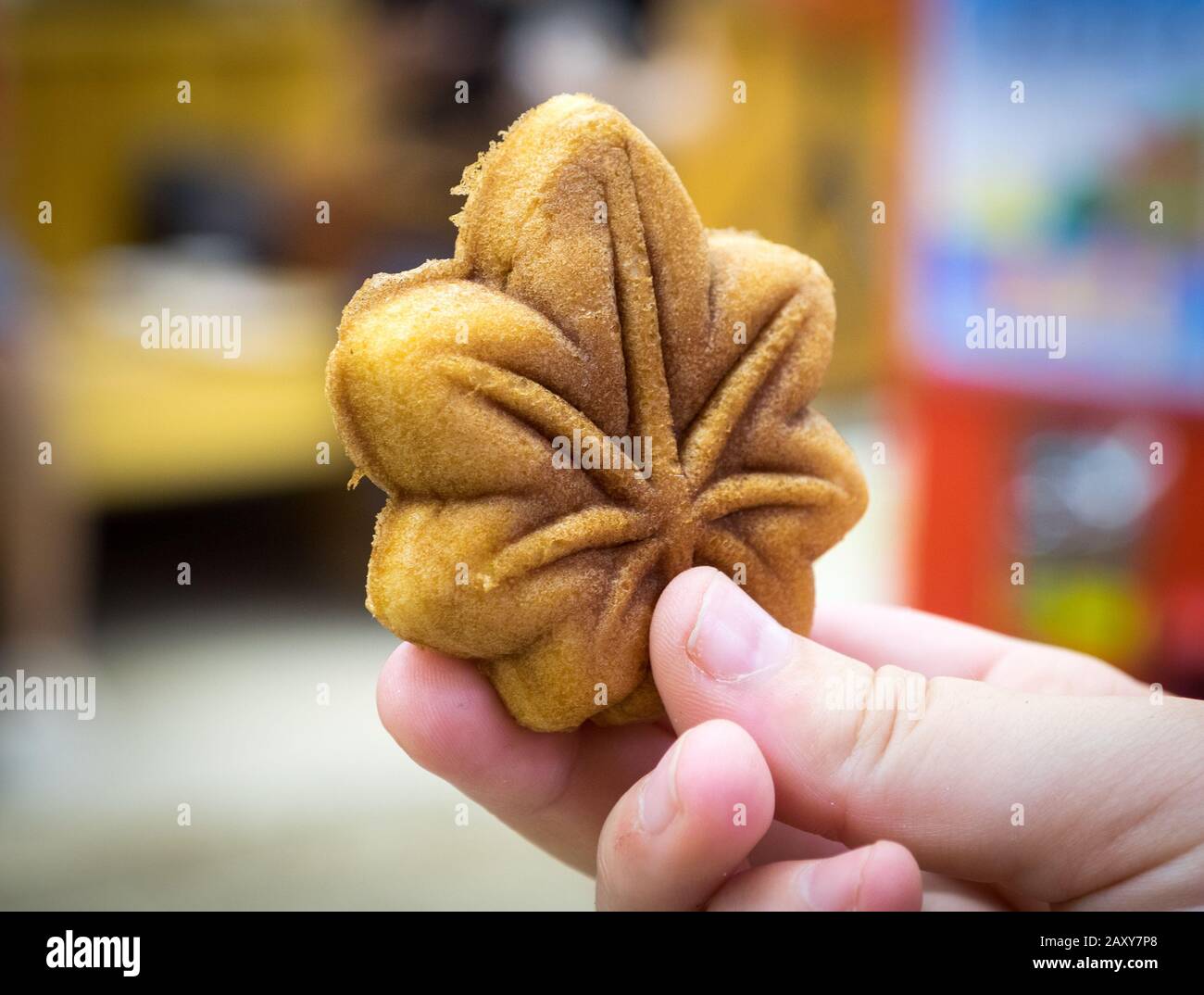 A delicious momiji manju, a maple-leaf shaped cookie (technically, a buckwheat and rice cake) that's a delicacy on the island of Miyajima, Japan. Stock Photo