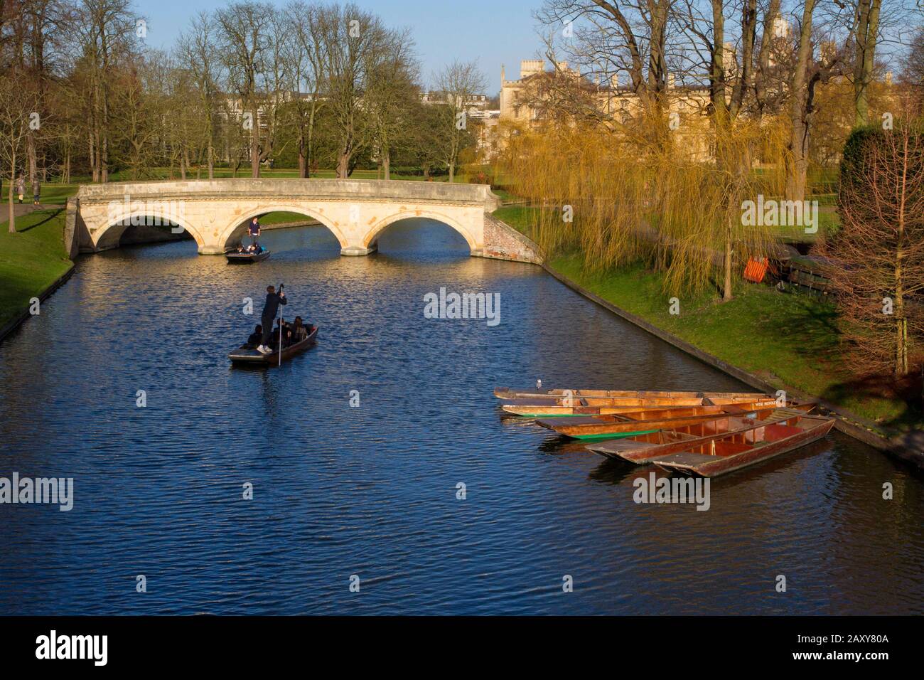 A scenic view of punting along the River Cam  from 'The Backs' of the colleges with St. John's University in the background, in Cambridge, England Stock Photo