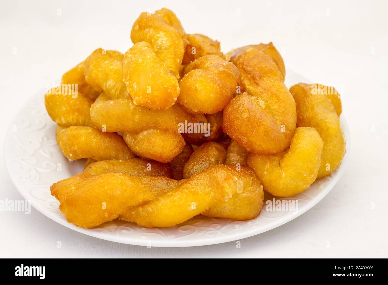 Koeksisters are a traditional Afrikaner confectionery made of fried dough and infused in syrup or honey image in horizontal format Stock Photo