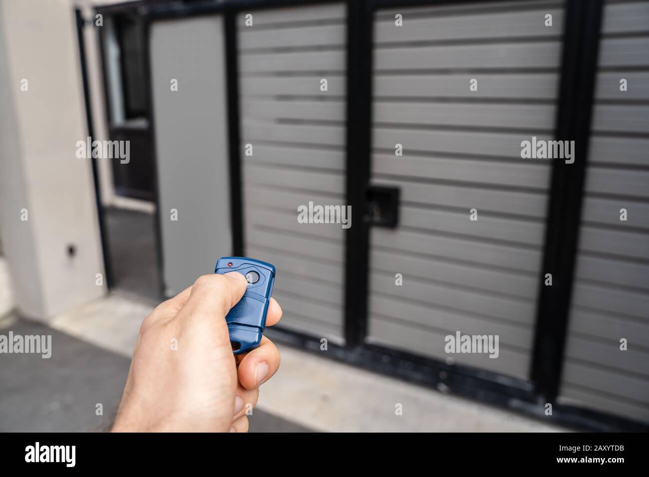 Using Remote Control To Open Electric Gate Stock Photo