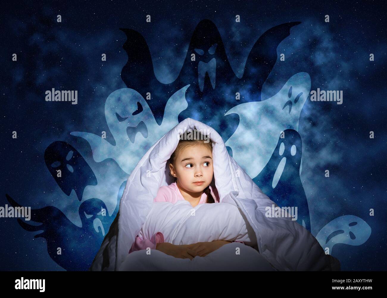 Worried girl hiding under blanket Stock Photo Alamy