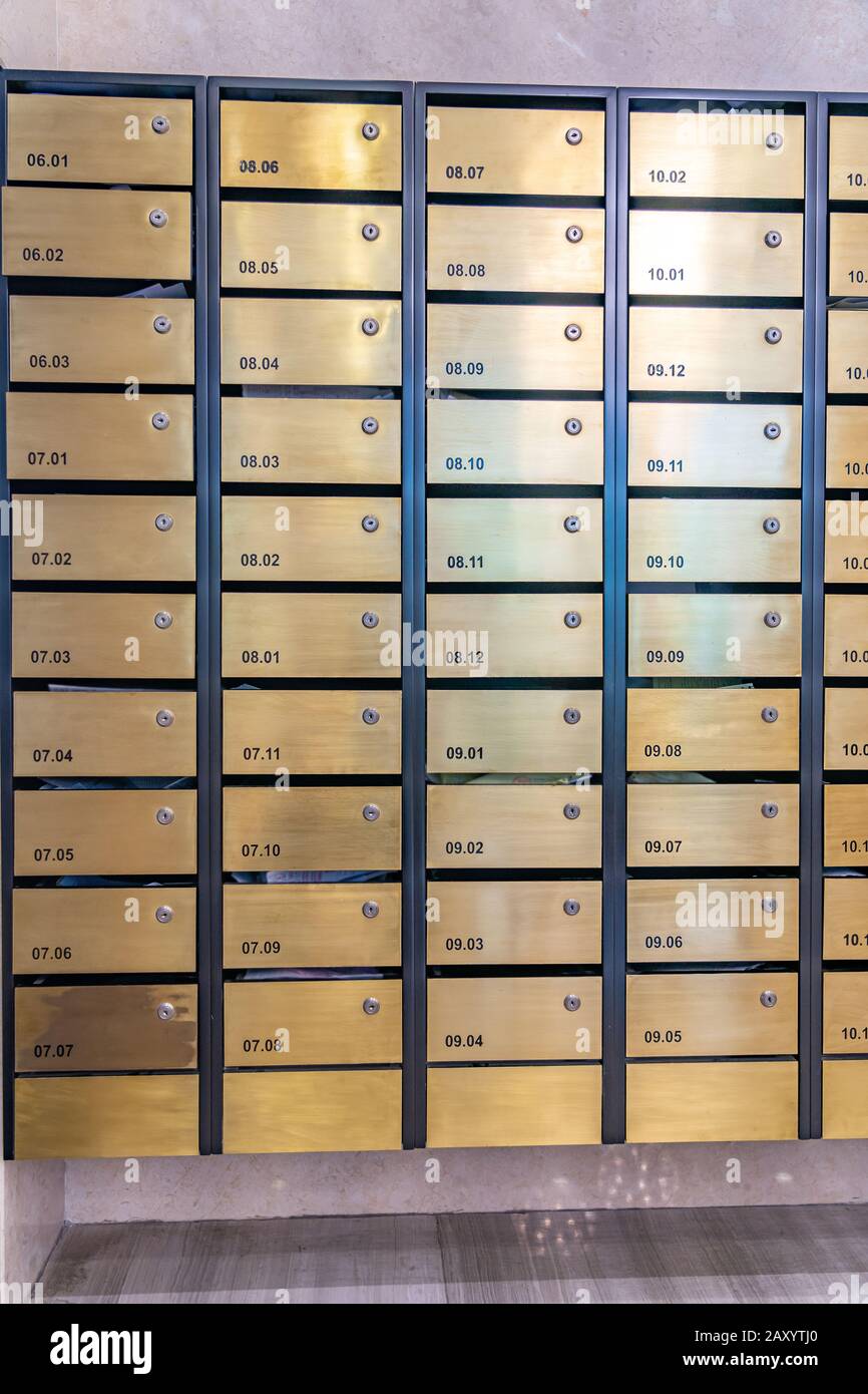 Metallic mailbox array in lobby of condominium building Stock Photo Alamy