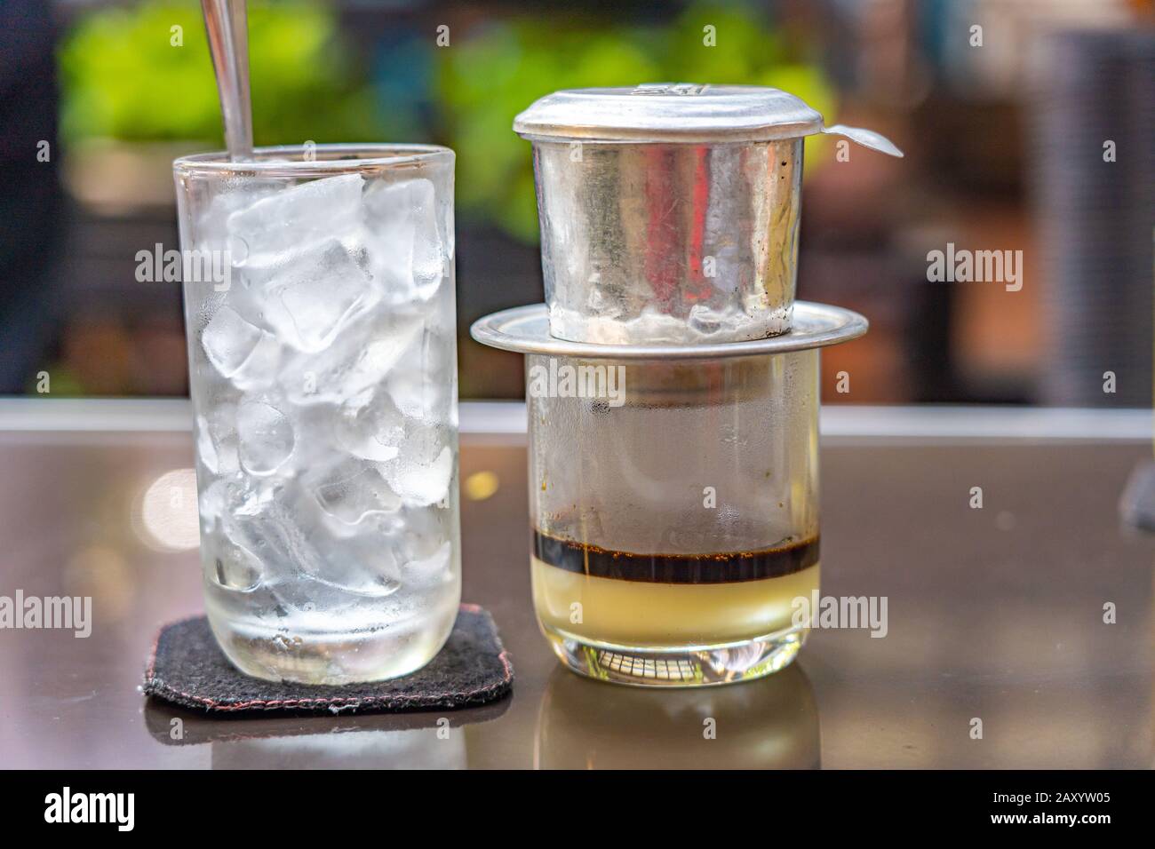 Traditional Vietnamese fin coffee with condensed milk and ice Stock ...